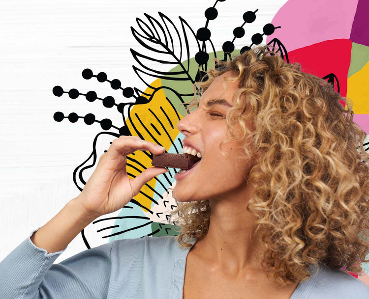 Curly haired girl enjoying the taste of superfruit acai bites