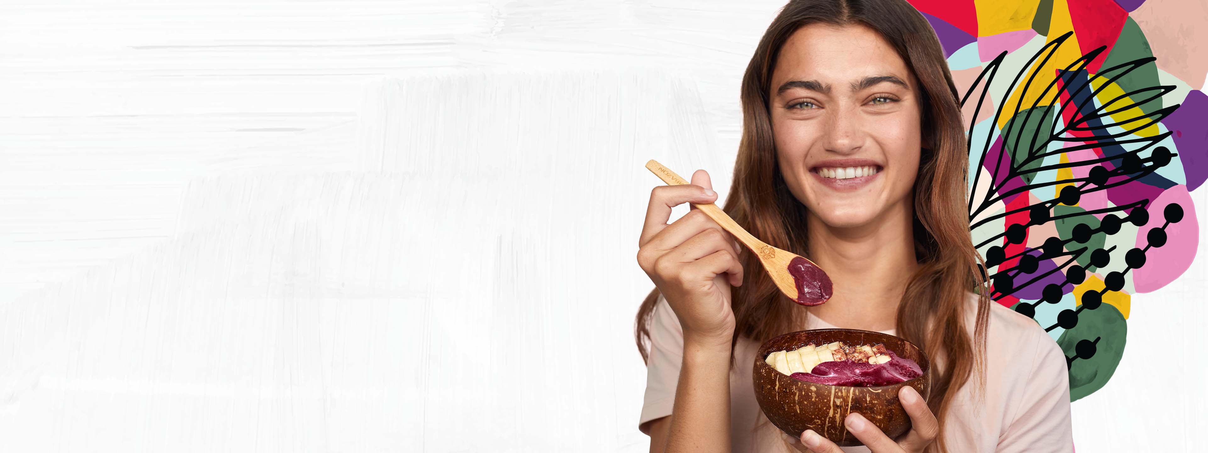 Girl eating acai bowls with a spoon