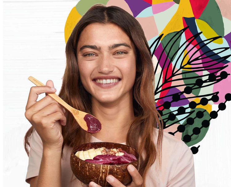 Girl eating acai bowls with a spoon