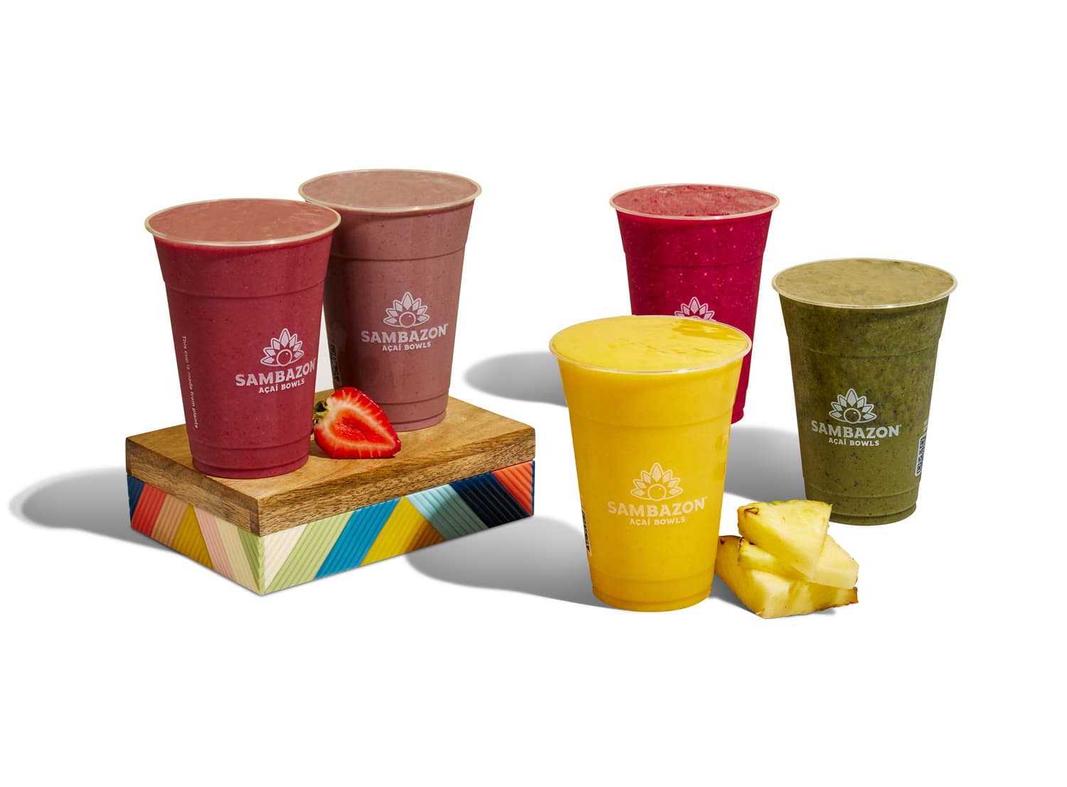 SAMBAZON Smoothies being showcased with colorful fruit and a colorful box