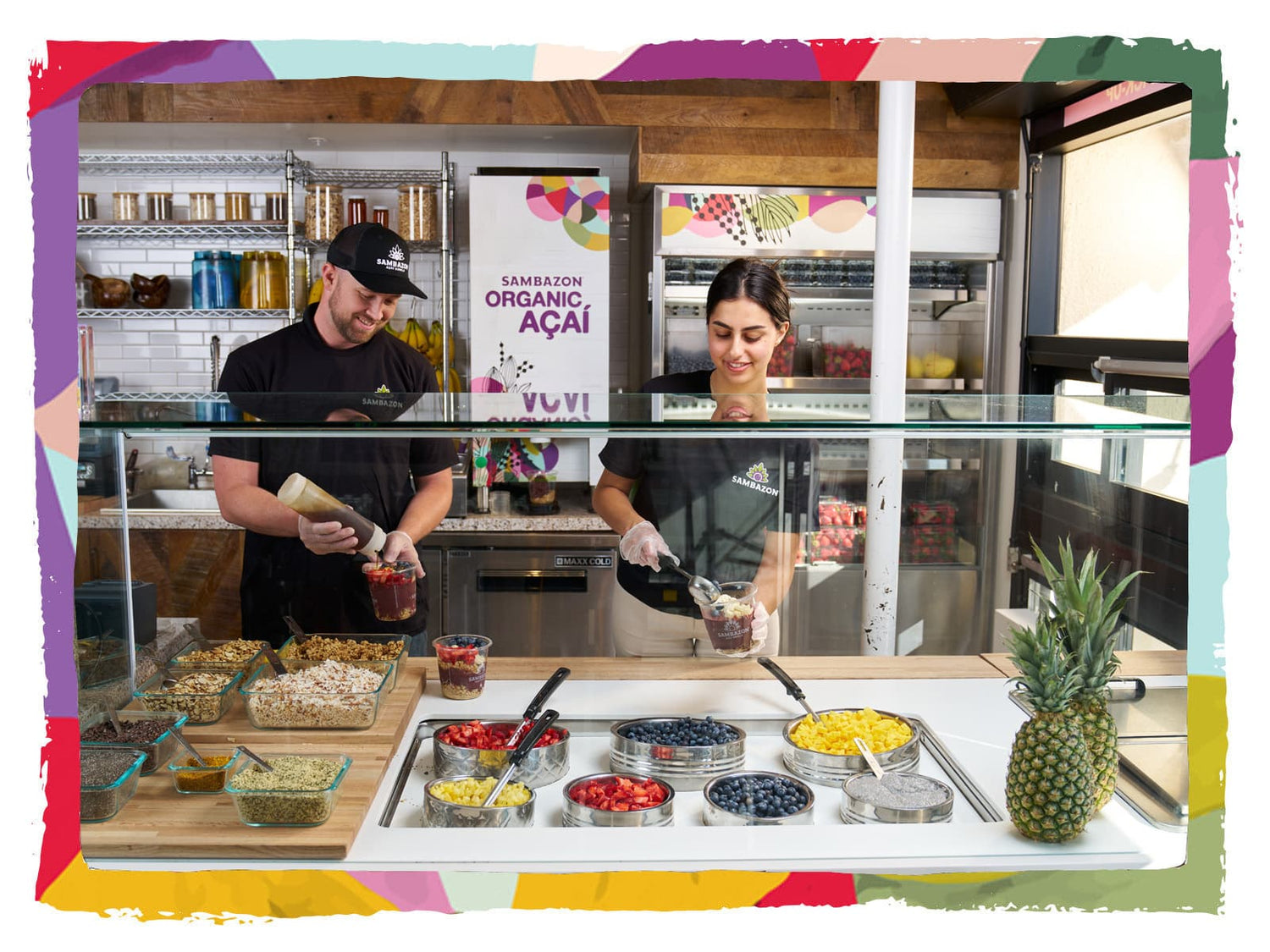 Two SAMBAZON employees making Delicious Acai Bowls