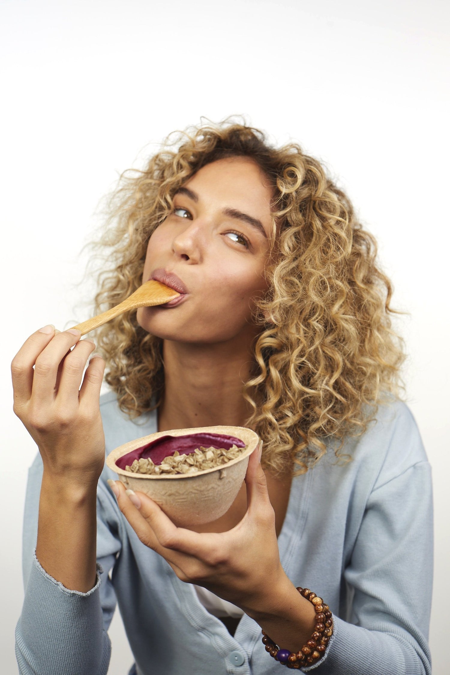 Rose Machado enjoying a spoonful of acai bowls