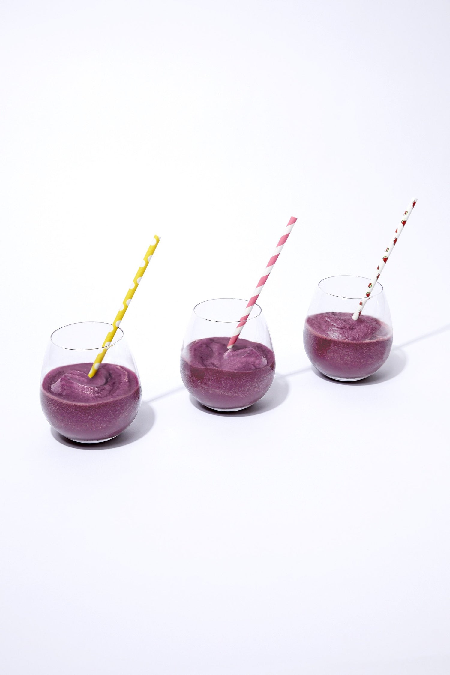 three acai smoothies made with frozen acai packets