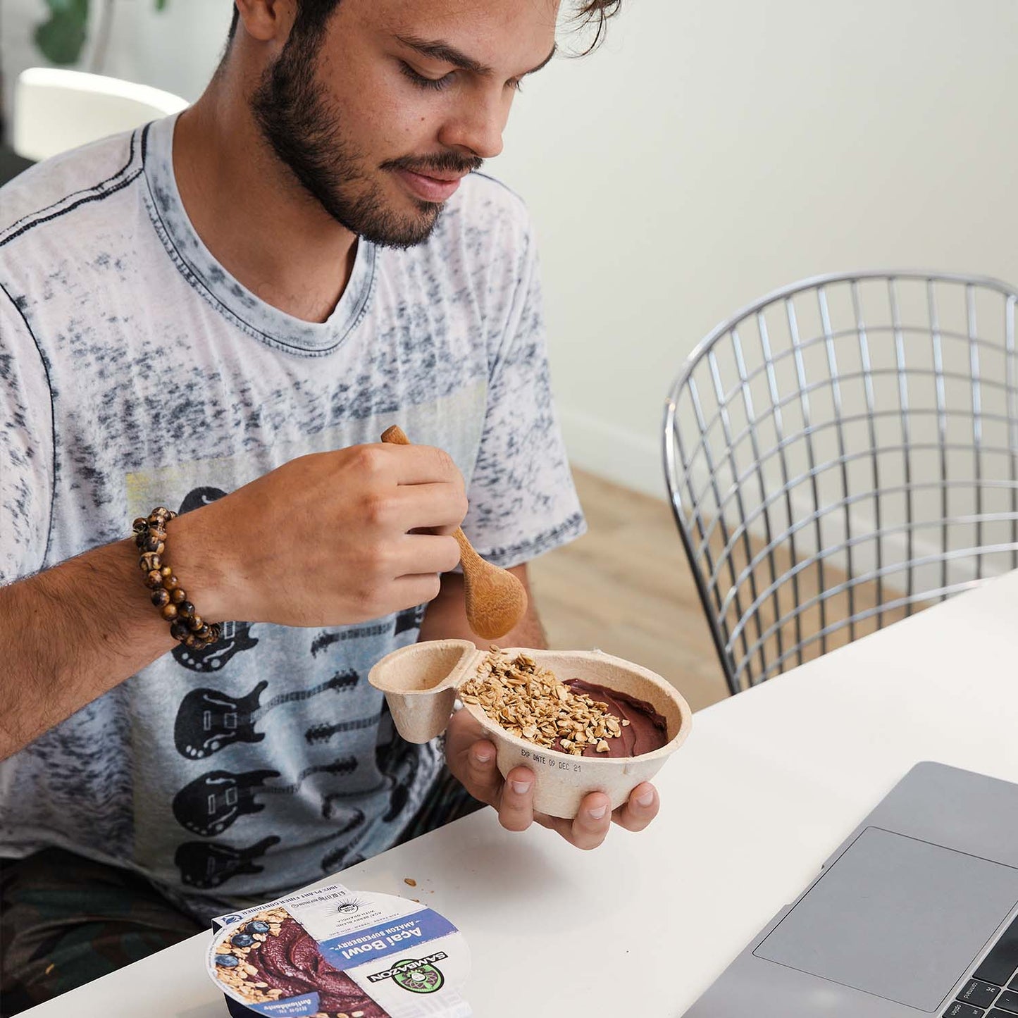 man enjoying acai bowls at home